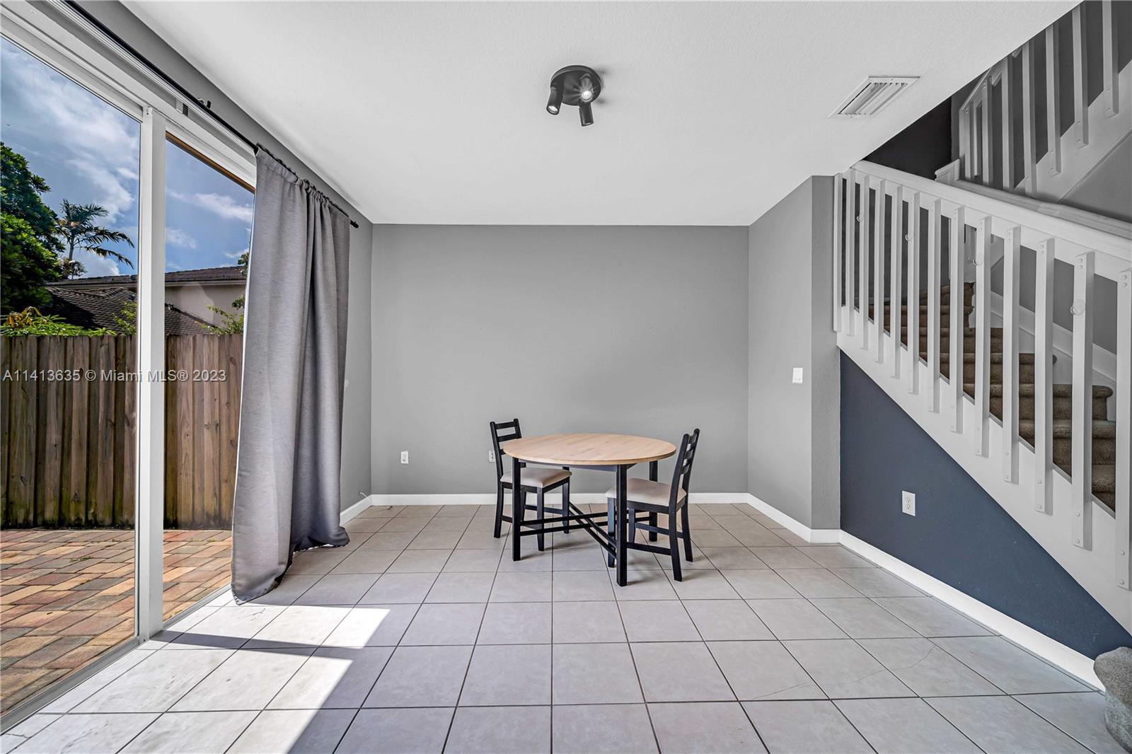 949 Northeast 42nd Avenue Homestead, FL 33033 - Photo 9 of 22 a view of a dining room with furniture and chandelier