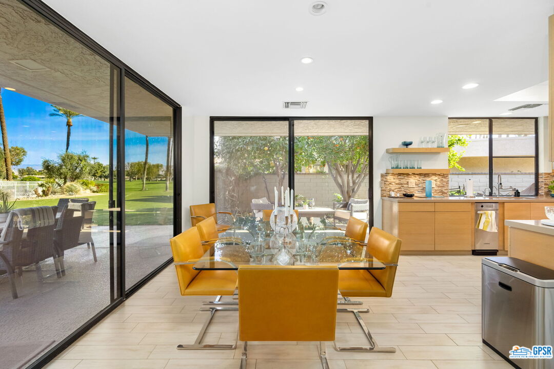 78 Colgate Drive Rancho Mirage, CA 92270 - Photo 11 of 56 a dining room with furniture and a floor to ceiling window