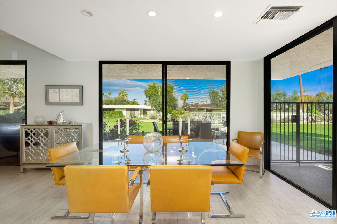 78 Colgate Drive Rancho Mirage, CA 92270 - Photo 12 of 56 a living room with furniture and a floor to ceiling window