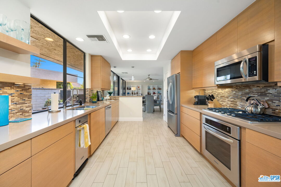 78 Colgate Drive Rancho Mirage, CA 92270 - Photo 13 of 56 a large kitchen with stainless steel appliances