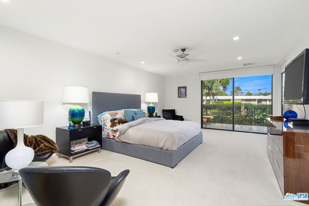 78 Colgate Drive Rancho Mirage, CA 92270 - Photo 21 of 56 a spacious bedroom with a bed and large windows