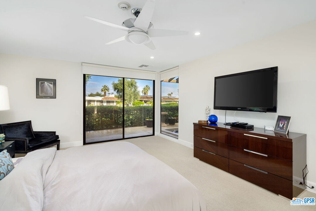 78 Colgate Drive Rancho Mirage, CA 92270 - Photo 22 of 56 a bedroom with a bed and a flat screen tv