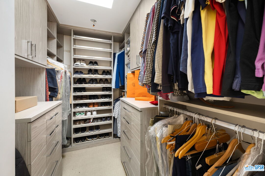 78 Colgate Drive Rancho Mirage, CA 92270 - Photo 26 of 56 a view of walk in closet with clothes and shoes