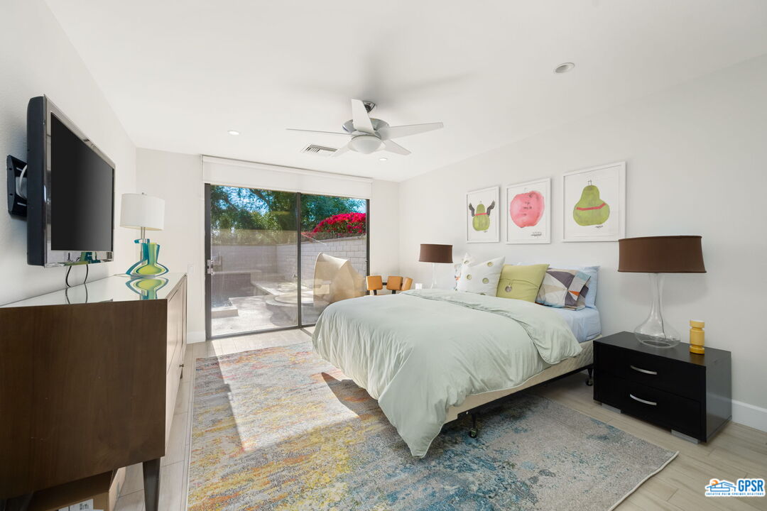 78 Colgate Drive Rancho Mirage, CA 92270 - Photo 27 of 56 a bedroom with a bed and a flat screen tv