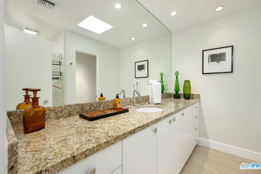 78 Colgate Drive Rancho Mirage, CA 92270 - Photo 28 of 56 a bathroom with a granite countertop sink and a mirror