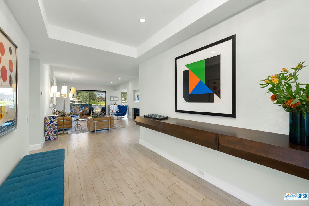 78 Colgate Drive Rancho Mirage, CA 92270 - Photo 3 of 56 a living room with furniture and a painting on the wall