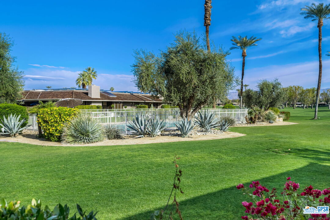 78 Colgate Drive Rancho Mirage, CA 92270 - Photo 44 of 56 a view of a golf course with a garden
