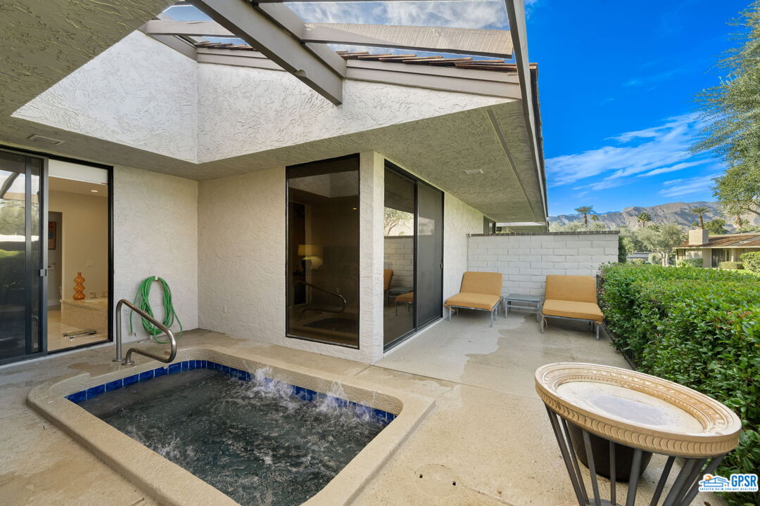 78 Colgate Drive Rancho Mirage, CA 92270 - Photo 46 of 56 a view of a porch with a table and chairs
