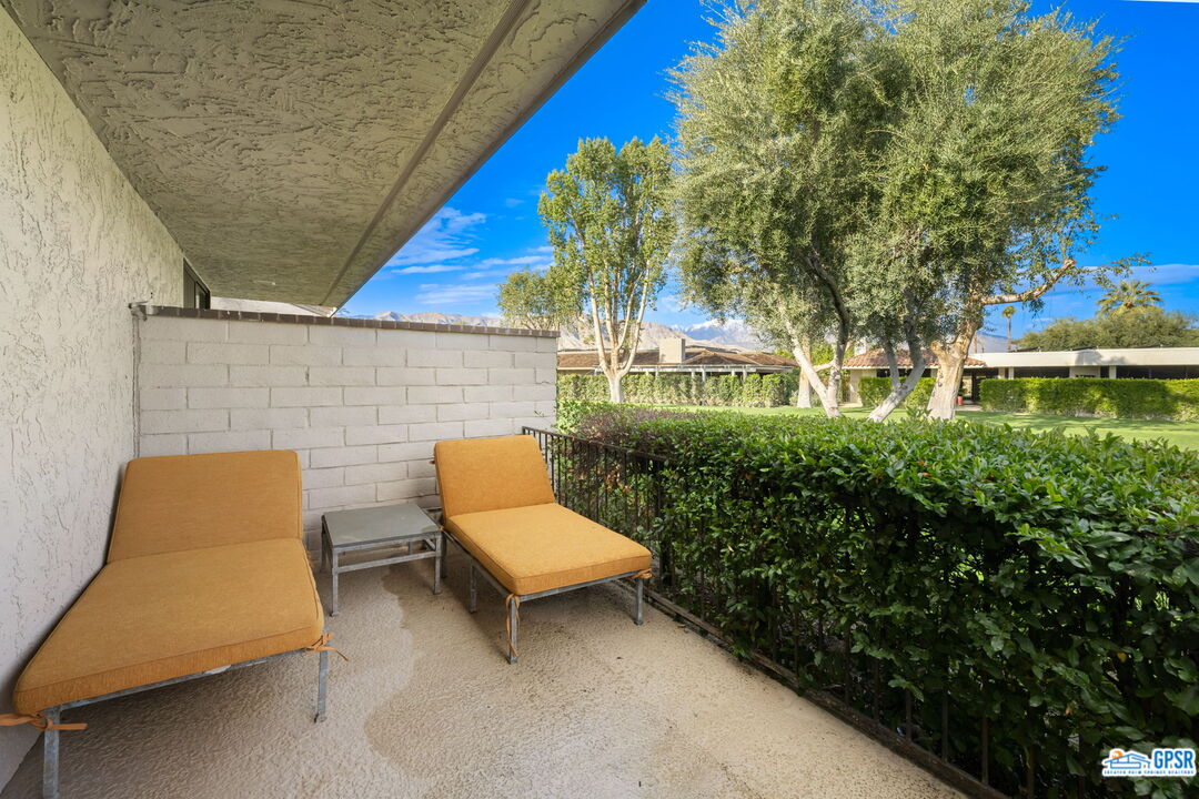 78 Colgate Drive Rancho Mirage, CA 92270 - Photo 47 of 56 a backyard of a house with sofas fire pit and chairs