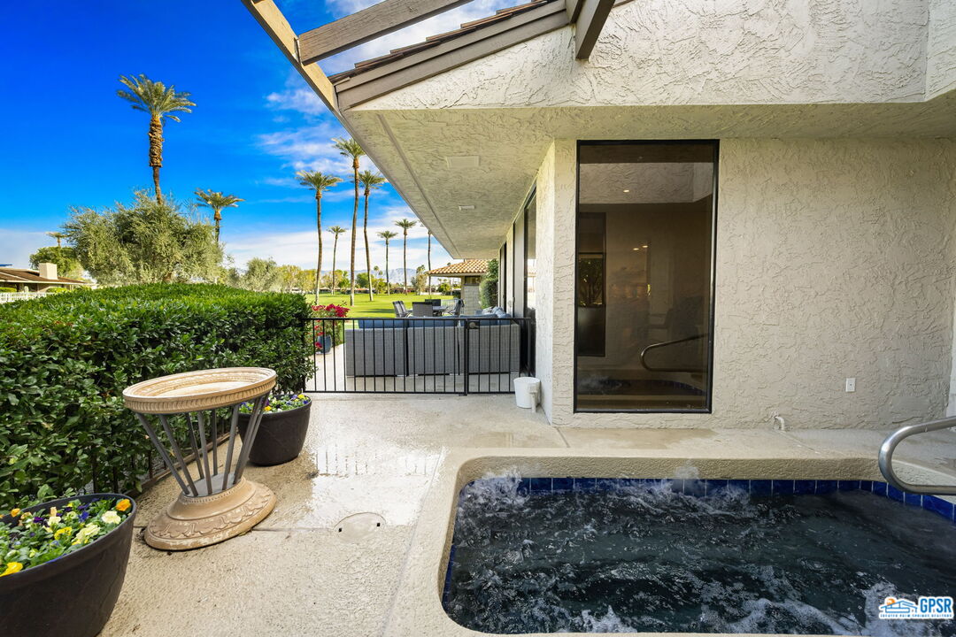 78 Colgate Drive Rancho Mirage, CA 92270 - Photo 48 of 56 a view of a porch with a table and chairs