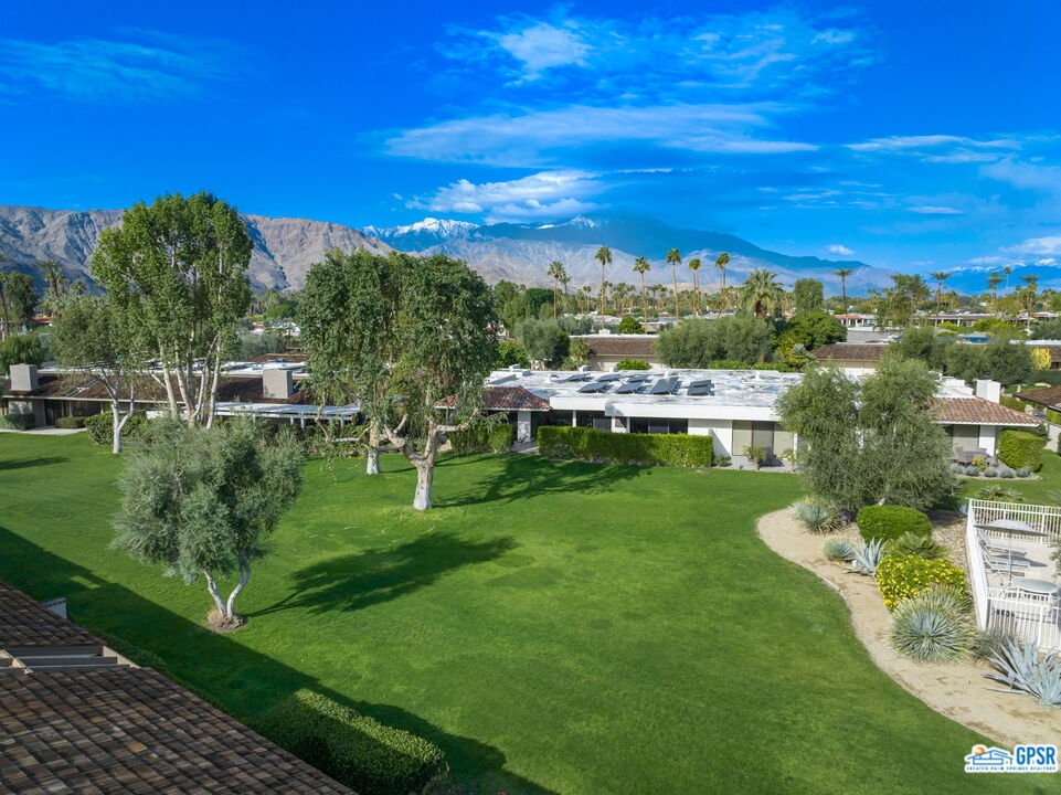 78 Colgate Drive Rancho Mirage, CA 92270 - Photo 53 of 56 a view of a garden with houses in the back