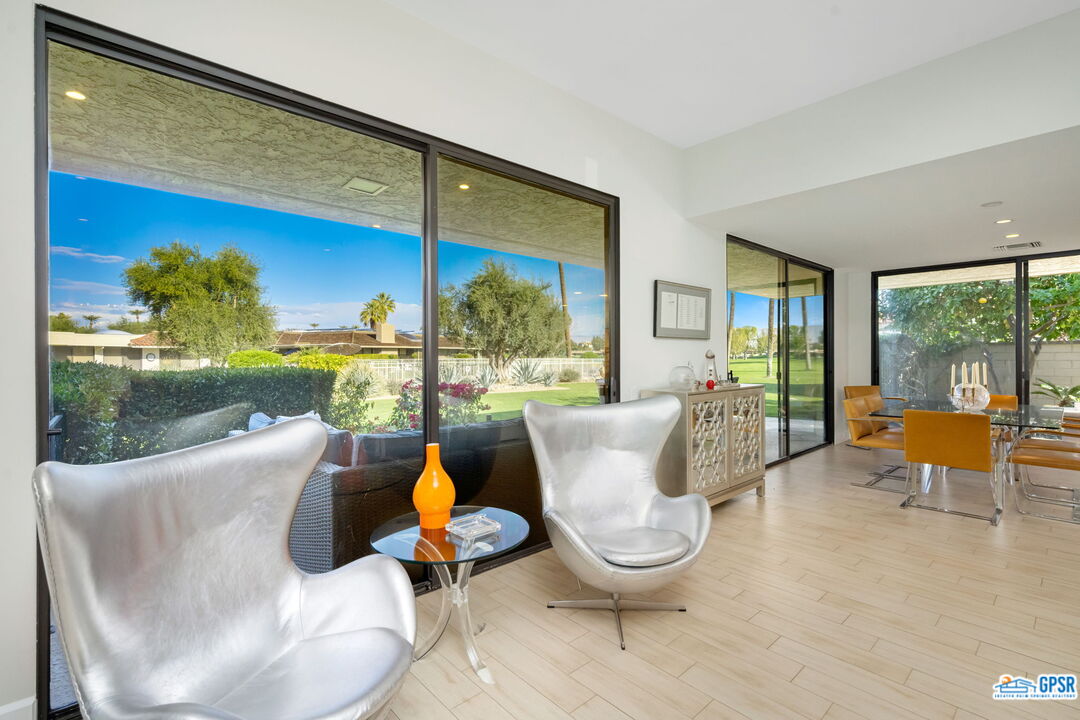 78 Colgate Drive Rancho Mirage, CA 92270 - Photo 10 of 56 a living room with patio furniture and a floor to ceiling window