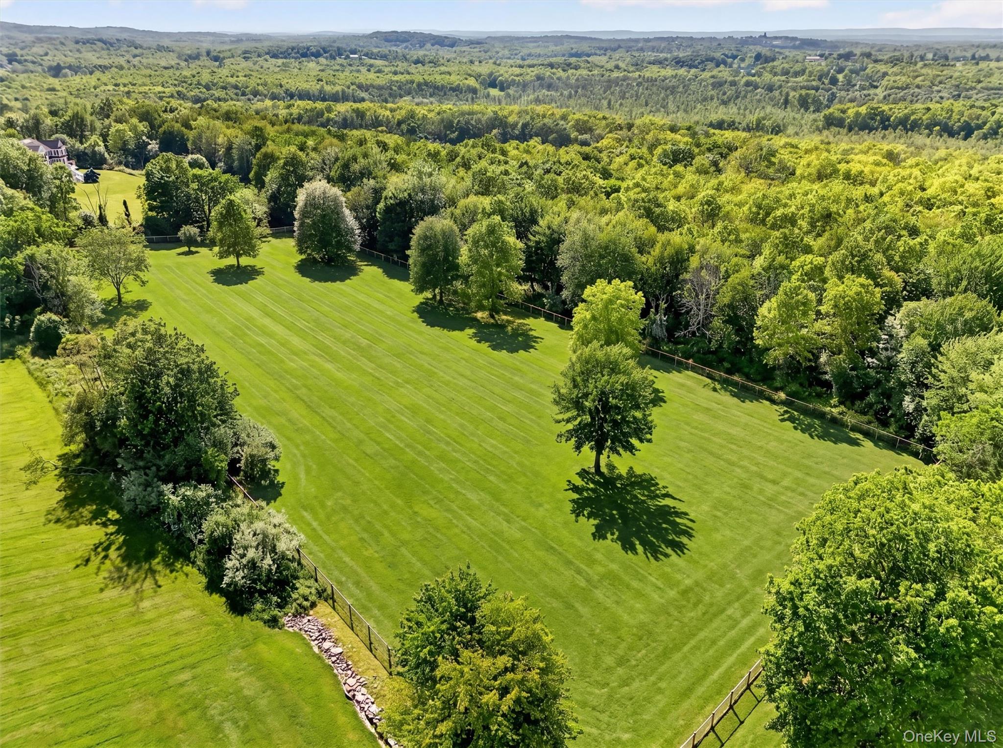 165 Hasbrouck Road Goshen, NY 10924 - Photo 37 of 50 Beyond this large, fenced field is the wooded part of the property for trail riding, hiking, or additional fields or infrastructure