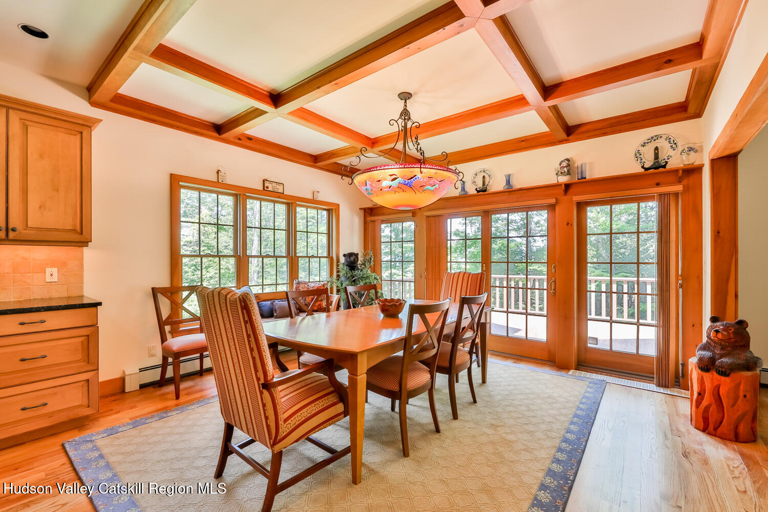37 White Way Windham, NY 12496 - Photo 11 of 71 a view of a dining room and livingroom with furniture wooden floor and a rug
