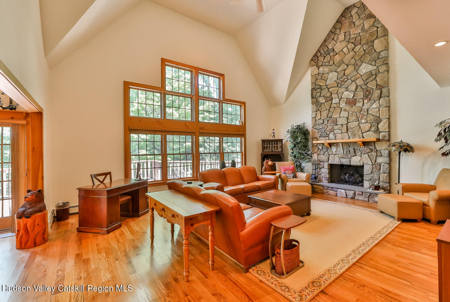 37 White Way Windham, NY 12496 - Photo 16 of 71 a living room with furniture a fireplace and a floor to ceiling window