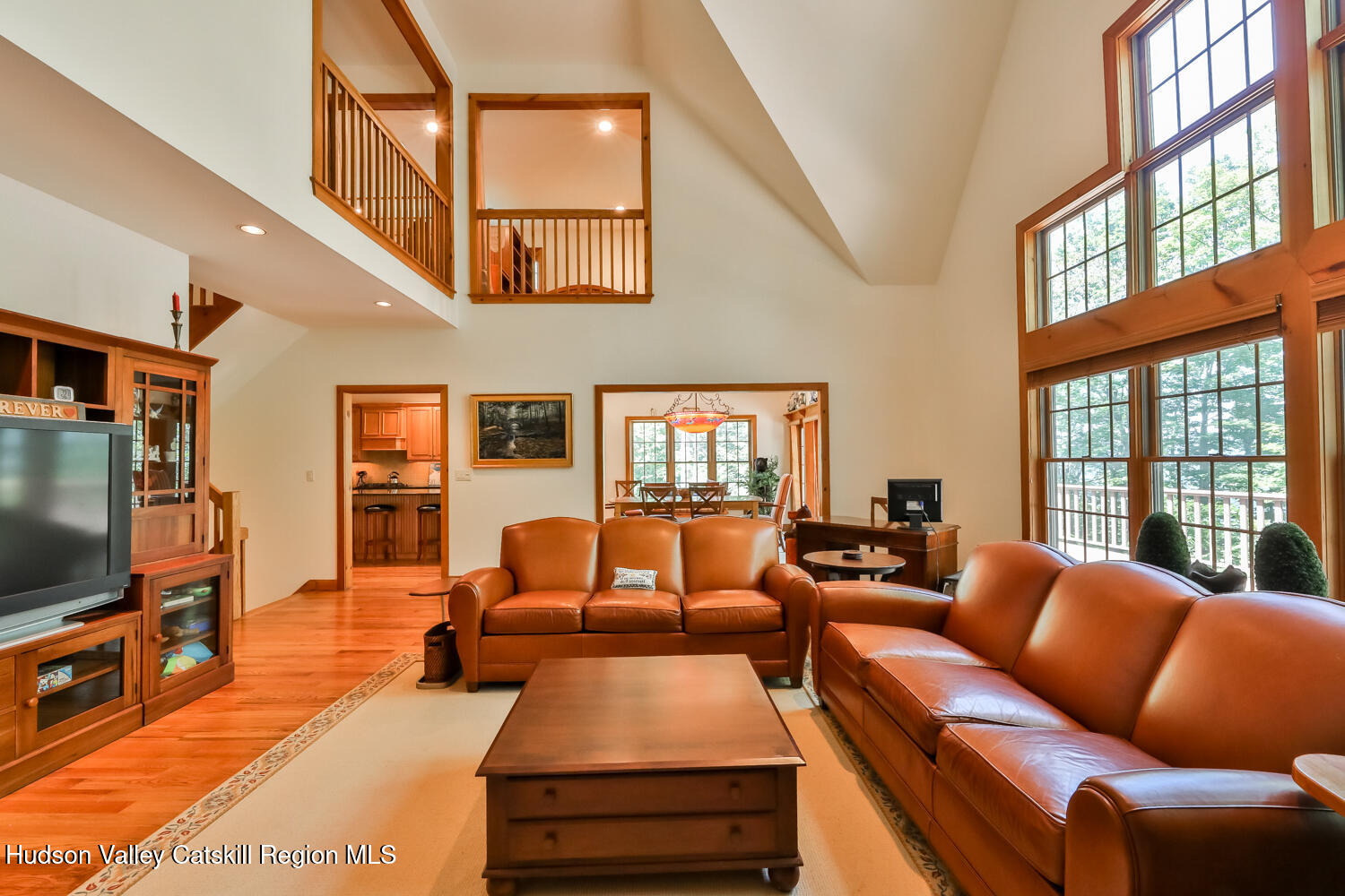 37 White Way Windham, NY 12496 - Photo 20 of 71 a living room with furniture a flat screen tv and a floor to ceiling window