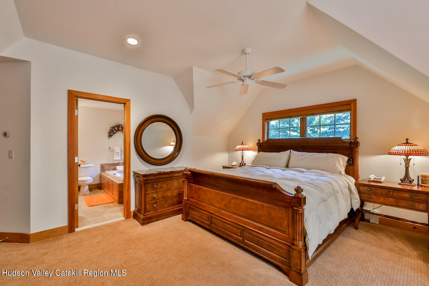 37 White Way Windham, NY 12496 - Photo 36 of 71 a spacious bedroom with a bed a dresser and a large window
