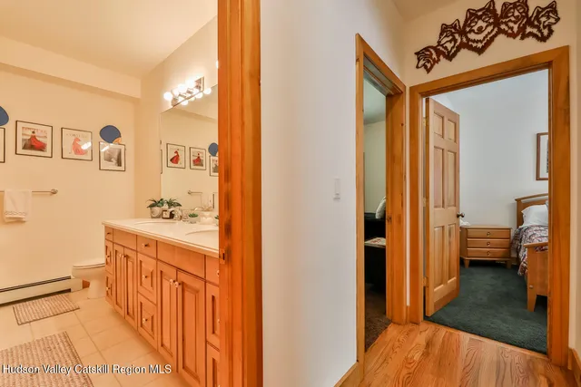 a street sign on a sidewalk next to a road