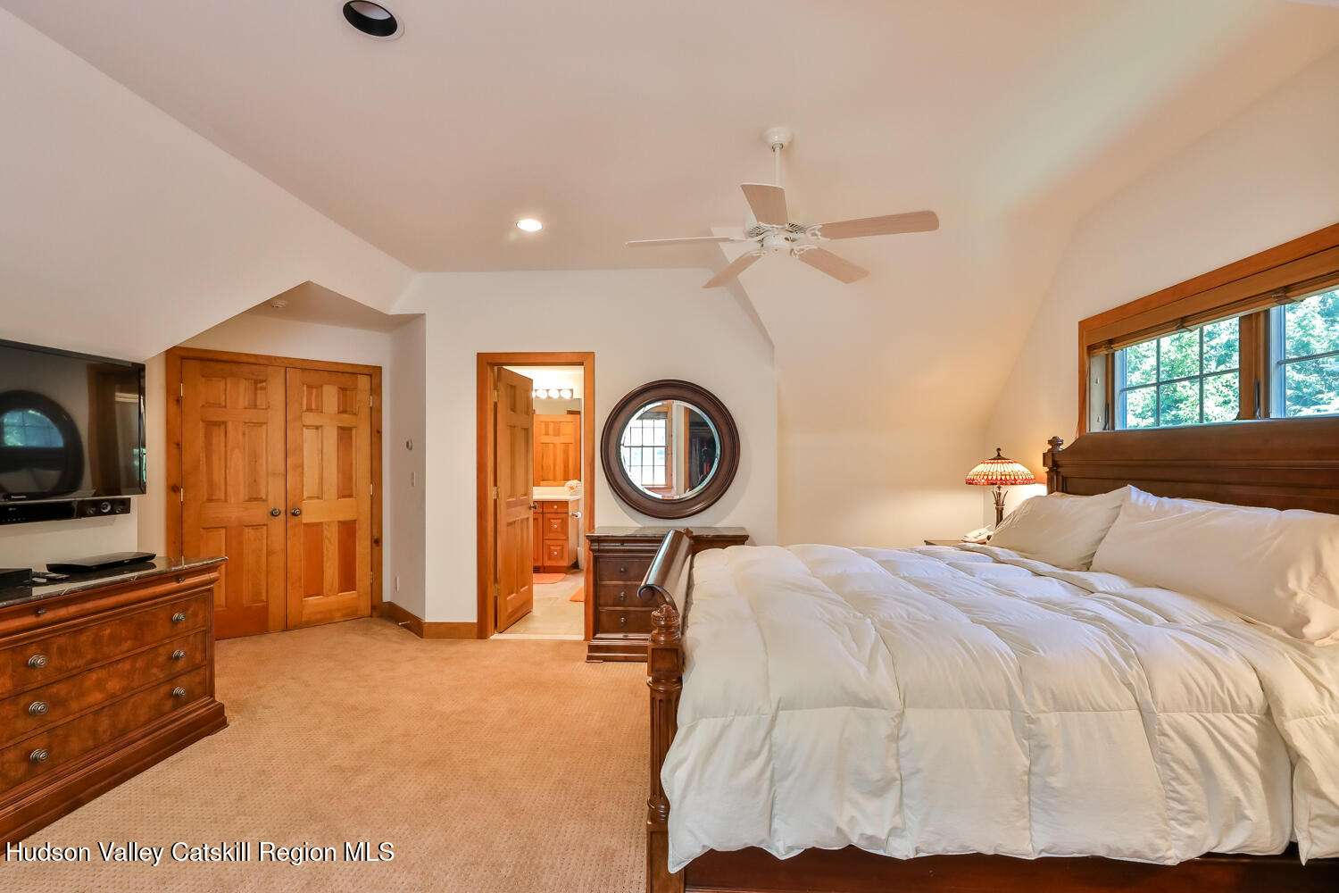 37 White Way Windham, NY 12496 - Photo 37 of 71 a bedroom with a bed and a flat tv screen on dresser