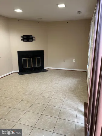 a view of a livingroom with a dishwasher and a fireplace