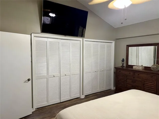 a bedroom with a bed and a dresser