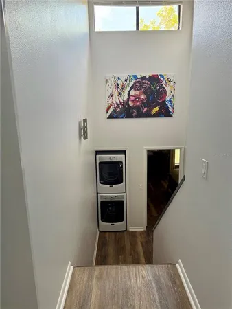a view of a utility room with wooden floor