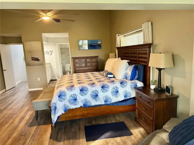 a bedroom with a bed and a dresser