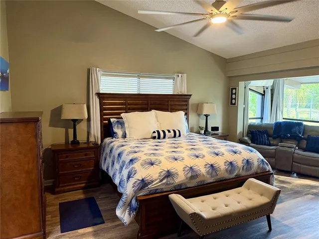 a view of a living room with furniture and wooden floor