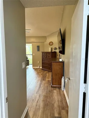 a spacious bathroom with a granite countertop sink and a mirror