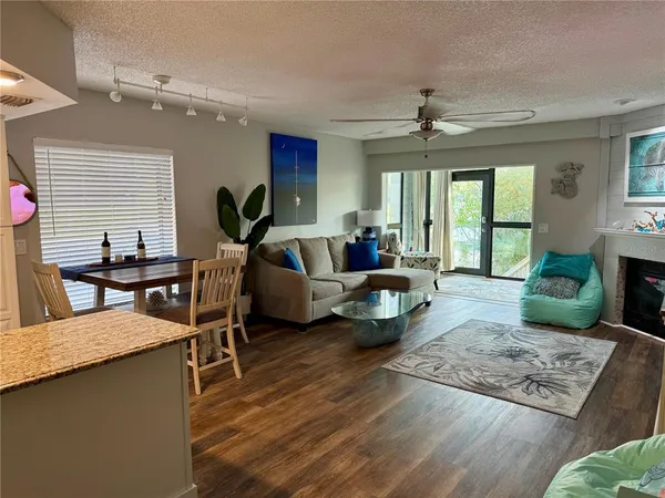 a living room with furniture rug and window