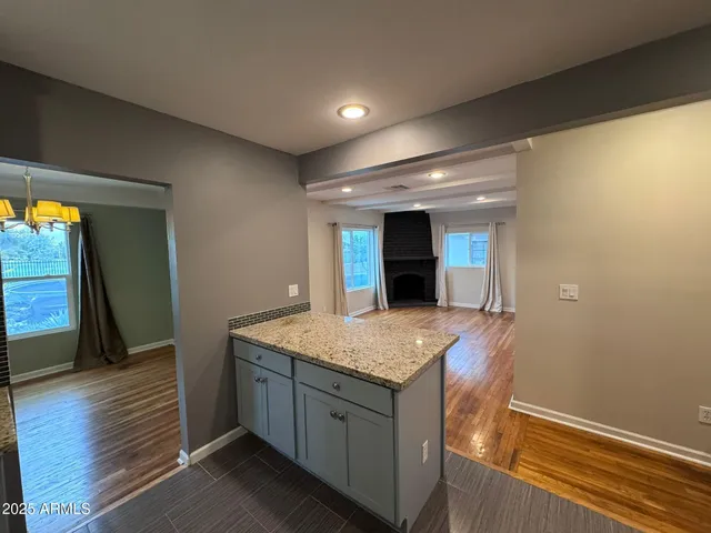 a view of a kitchen with a sink and a stove top oven