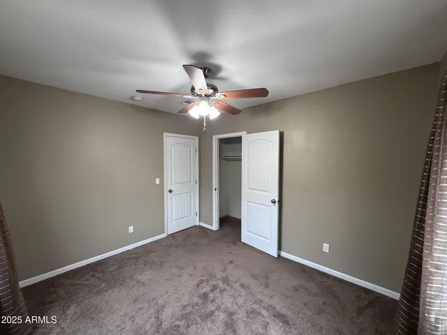 a bathroom with a tub sink vanity and mirror
