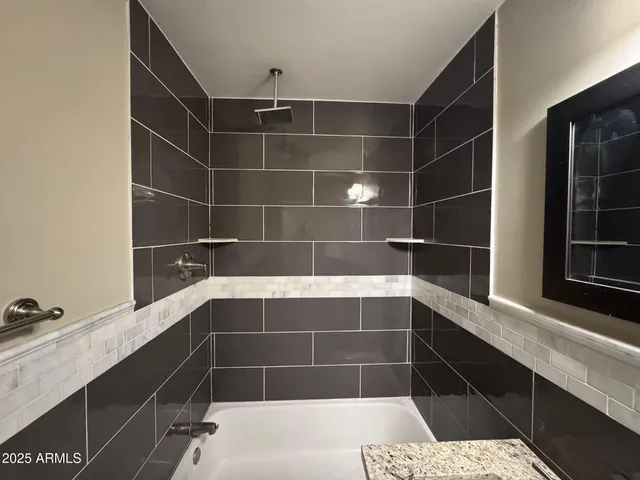 a kitchen that has a sink and a stove