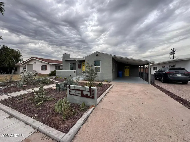 a view of a house with truck parked