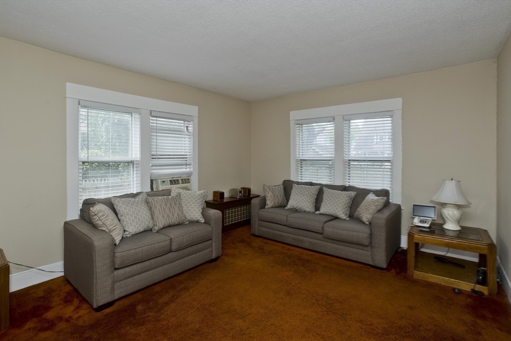 40 Eldridge Street Springfield, MA 01108 - Photo 13 of 22 a living room with furniture and a window