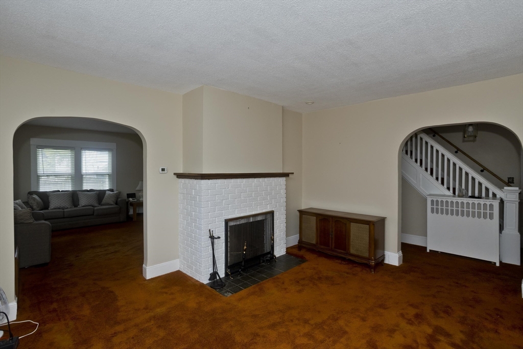 40 Eldridge Street Springfield, MA 01108 - Photo 14 of 22 a view of a livingroom with furniture and a fireplace