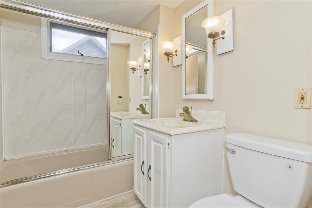 40 Eldridge Street Springfield, MA 01108 - Photo 15 of 22 a bathroom with a granite countertop sink toilet and shower