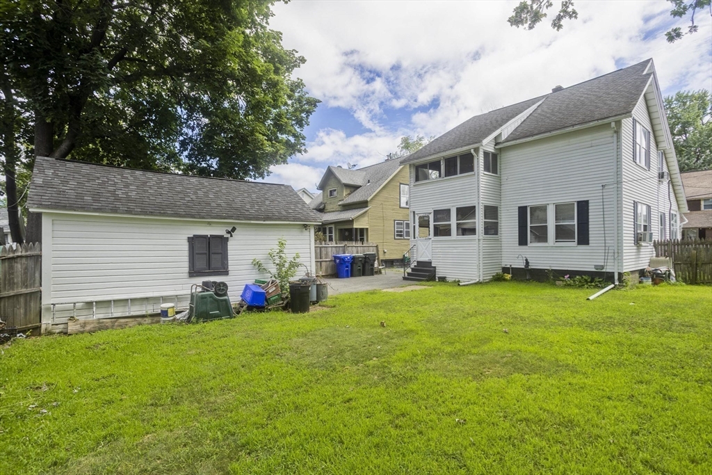 40 Eldridge Street Springfield, MA 01108 - Photo 3 of 22 a view of a house with a yard and sitting area