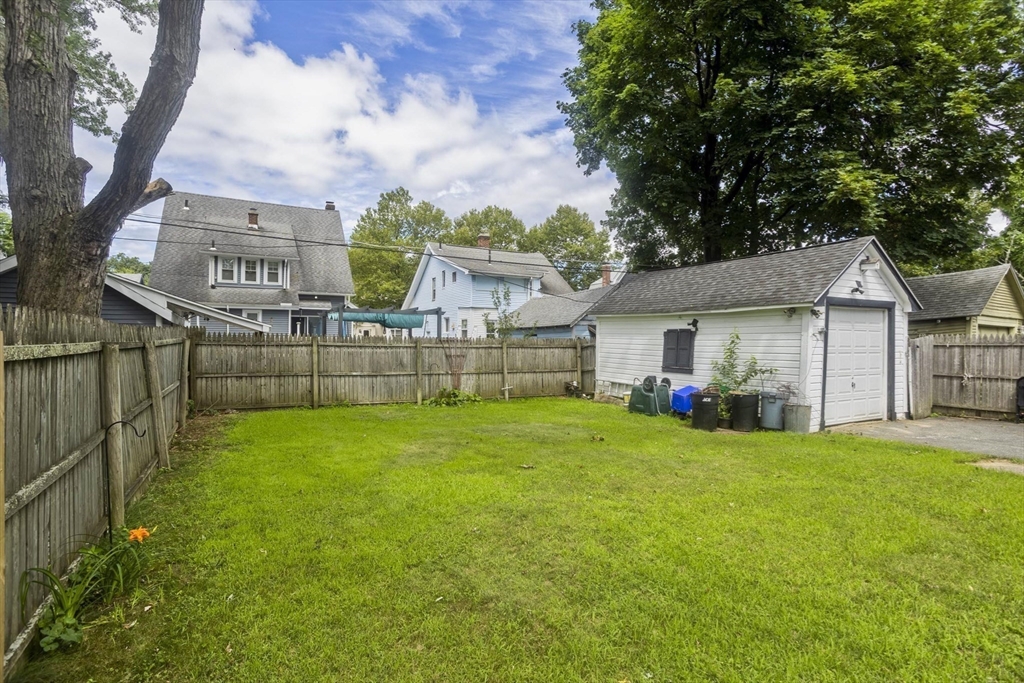 40 Eldridge Street Springfield, MA 01108 - Photo 4 of 22 a view of a house with a yard and sitting area