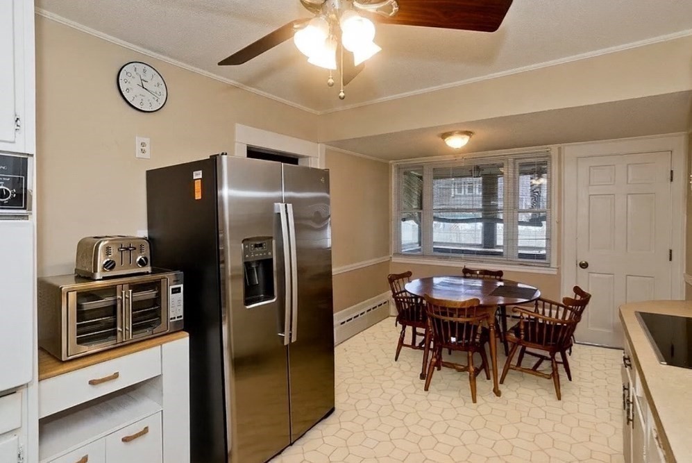 40 Eldridge Street Springfield, MA 01108 - Photo 7 of 22 a kitchen with stainless steel appliances kitchen island granite countertop a refrigerator and a stove top oven
