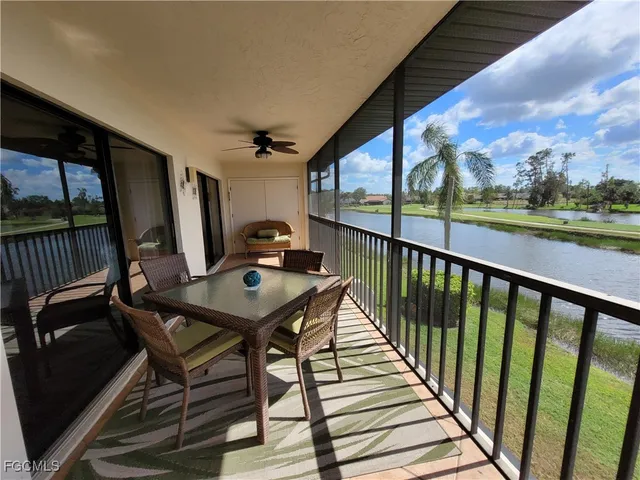 a view of a balcony with furniture