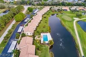 a view of a large building with a big yard and large trees