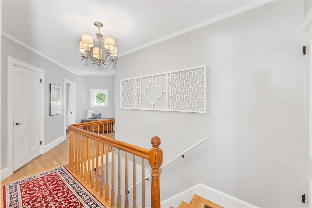 112 Perham Street Boston, MA 02132 - Photo 27 of 36 a view of a hallway with a chandelier