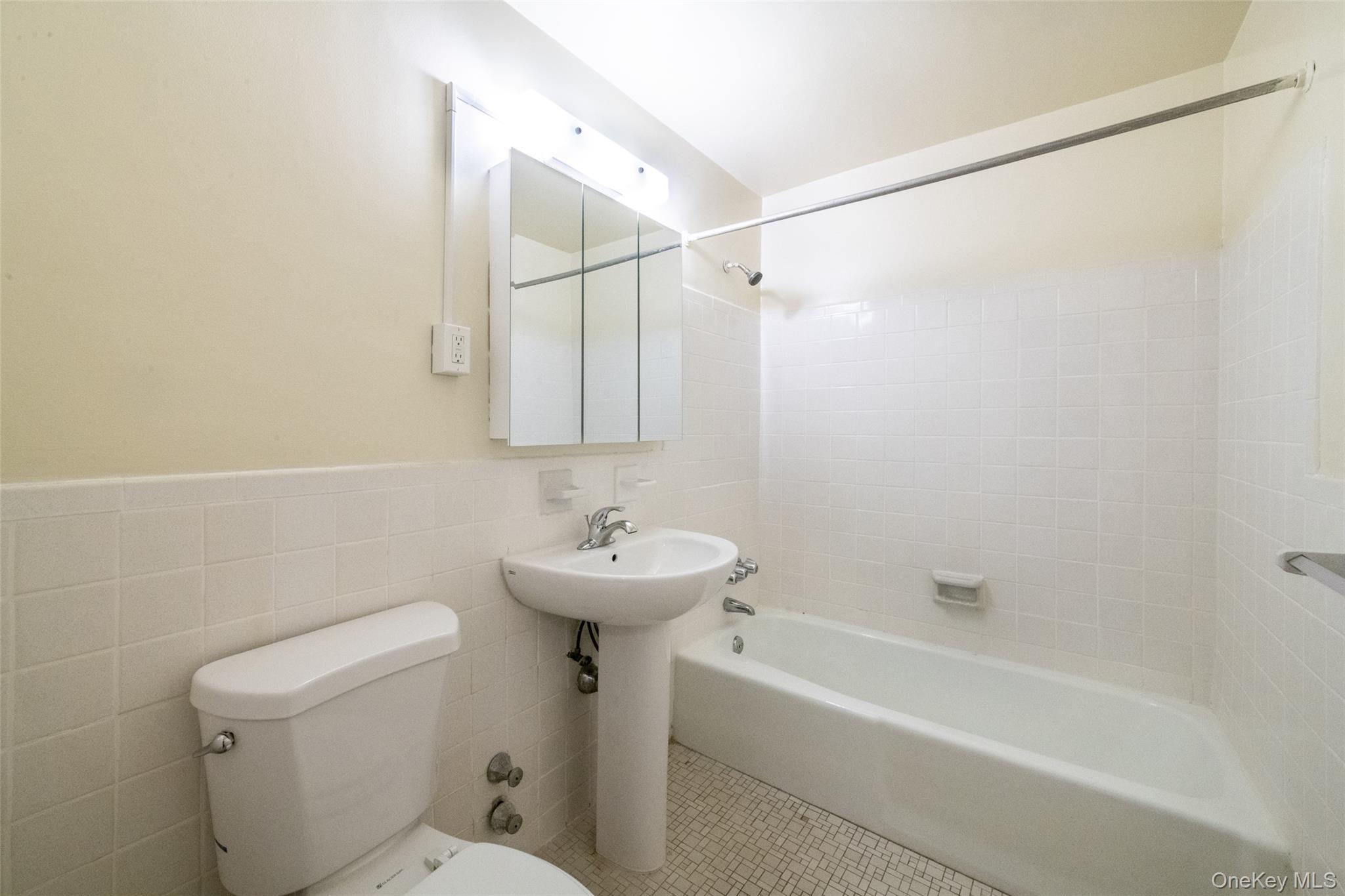 15 Lake Street, Unit 2D White Plains, NY 10603 - Photo 5 of 10 a bathroom with a sink a toilet and shower