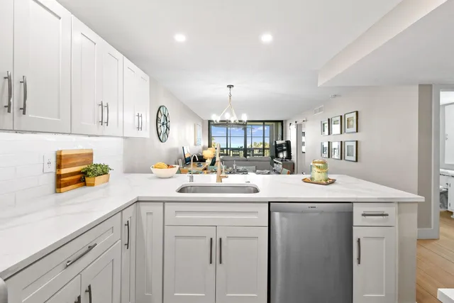 a kitchen with sink and cabinets