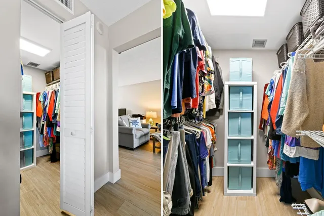 a view of walk in closet with clothes