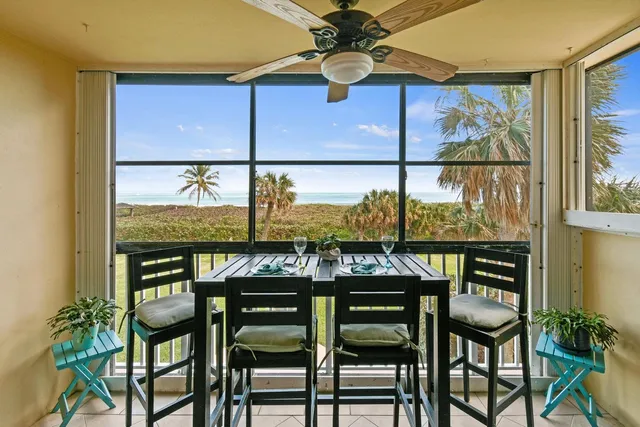 a view of an outdoor dining space with furniture