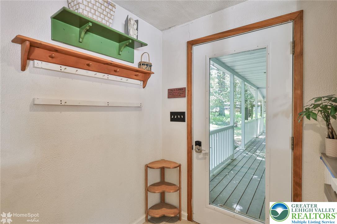 60 Sassafras Road Lehighton, PA 18235 - Photo 12 of 36 A welcoming entry offers a view to the shaded, expansive porch.
