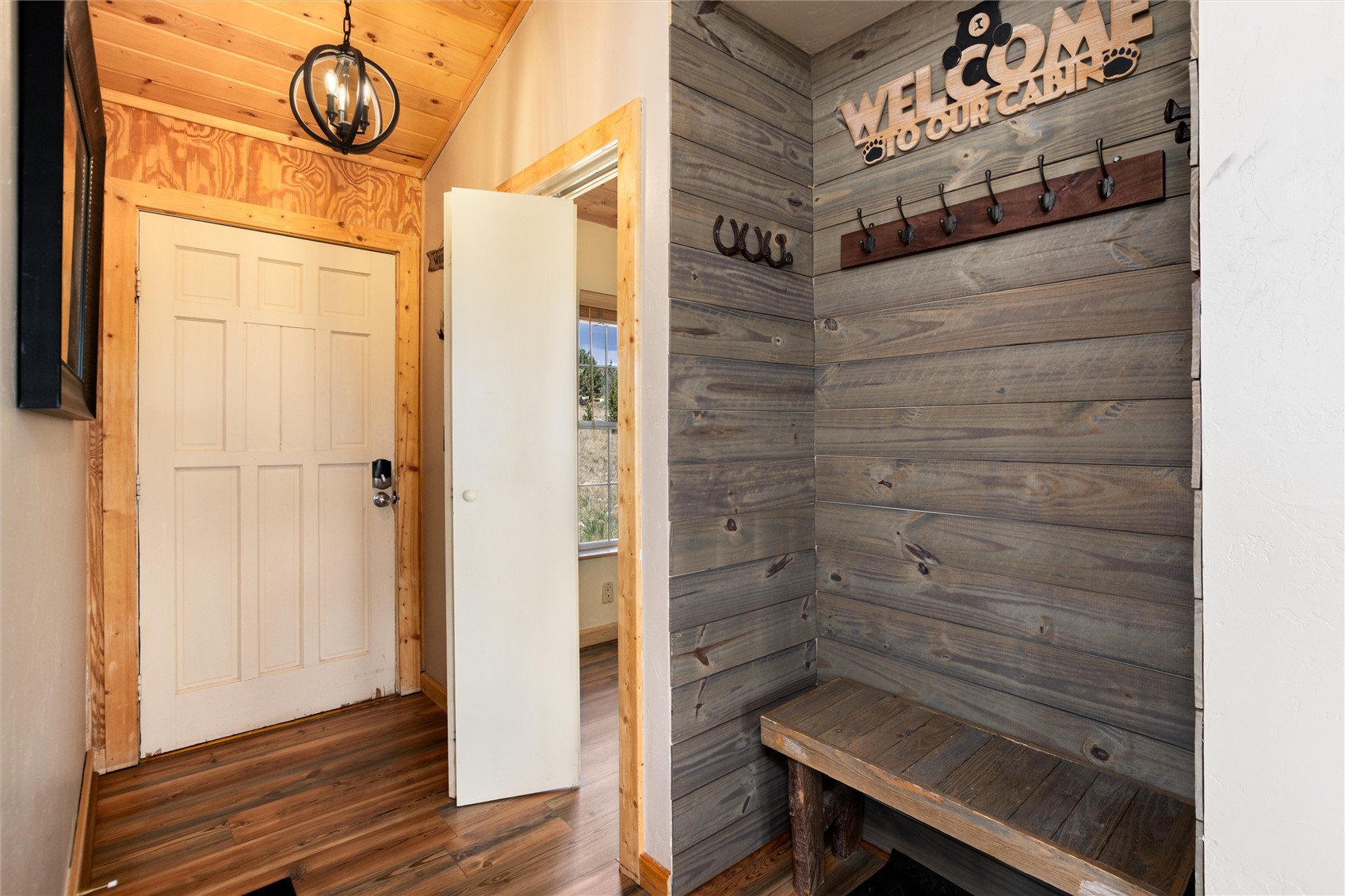1301 Sheep Ridge Road Fairplay, CO 80440 - Photo 11 of 49 Entryway featuring wood-finish flooring and a paneled door