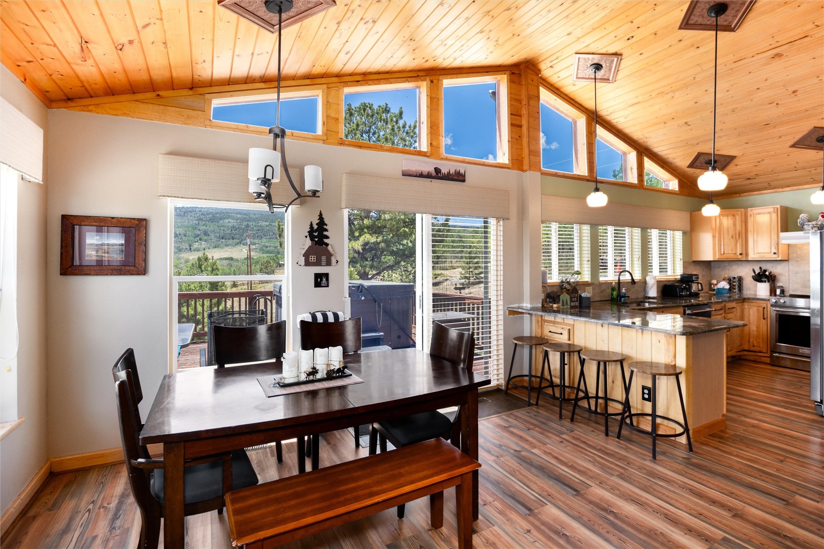 1301 Sheep Ridge Road Fairplay, CO 80440 - Photo 13 of 49 a dining room with furniture a chandelier and wooden floor